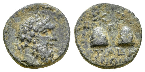 Ancient Greek City coin minted in Tabai, Caria in 81-1 BC - Zeus and Caps of the Dioscuri
